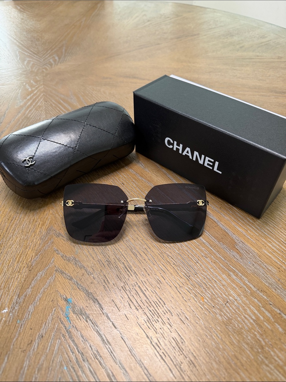 CHANEL Black Rimless Square Sunglasses with Gold Accents